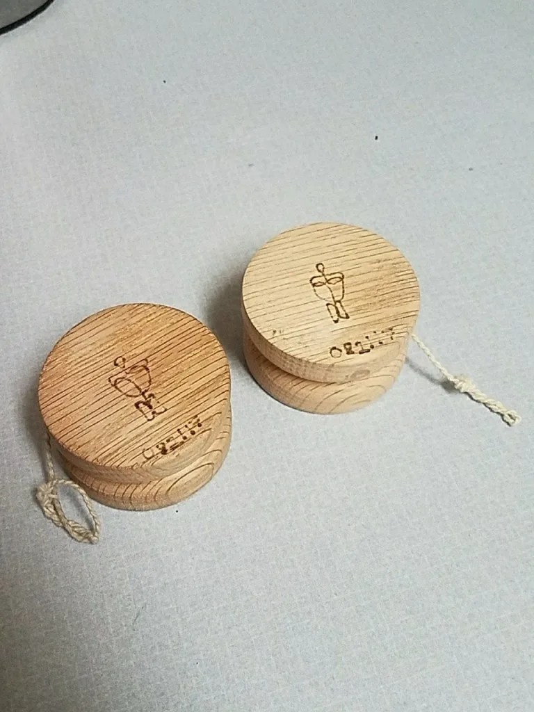 Two Mike Monty Roots wooden yo-yos viewed from above