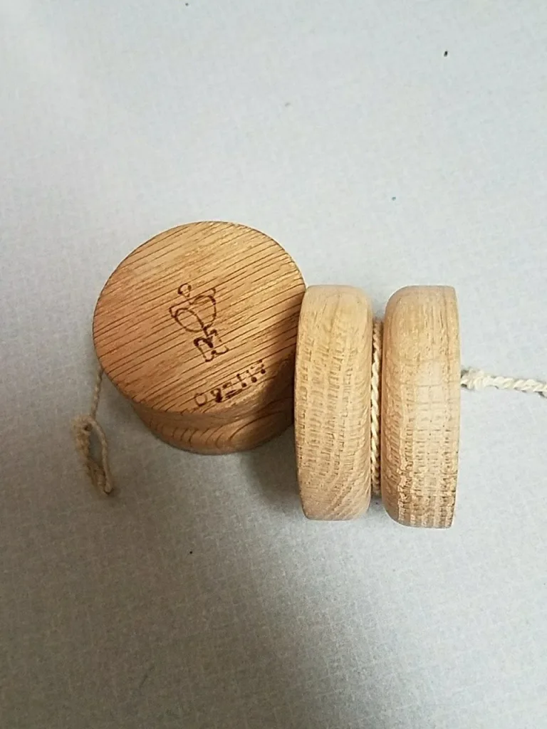 Mike Monty Roots wooden yo-yos showing top and side profiles